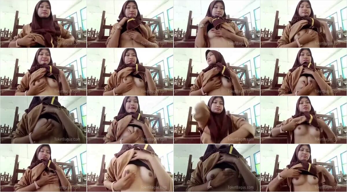 Murid SMP jilbab pramuka dalam kelas