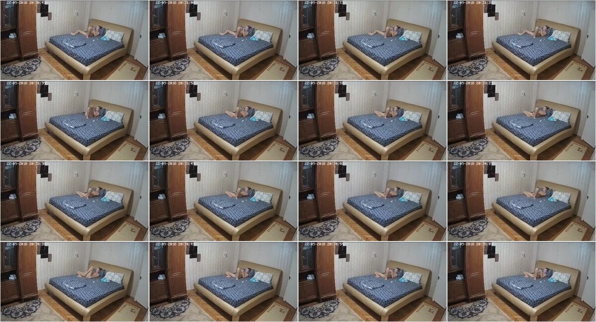 Horny blonde girl watching phone porn and fingering pussy on the bed  hidden cam